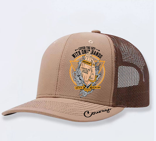 Tan trucker hat with 'Cover the Sky With Only Hands' graphic, mesh back, and 'Courage' script on brim