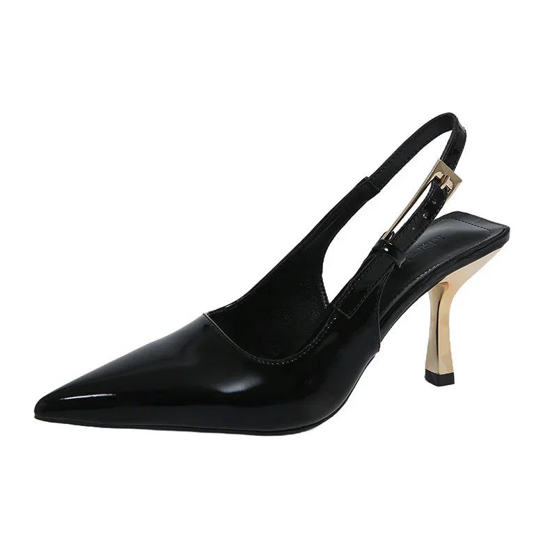 Black patent leather slingback pump with gold heel, minimalist design