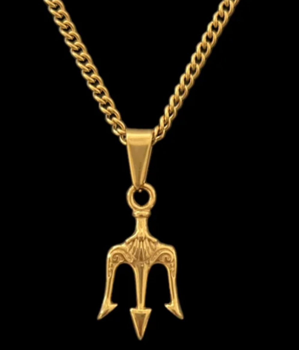 Gold trident pendant necklace with ornate detailing on curb chain, luxury minimalist jewelry
