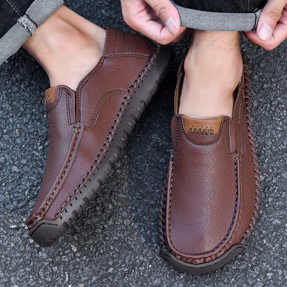 Brown leather loafers with braided detailing and comfortable sole, perfect for casual wear