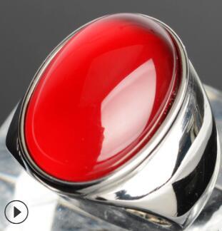 Luxury red cabochon ring with polished silver band, minimalist design, premium jewelry
