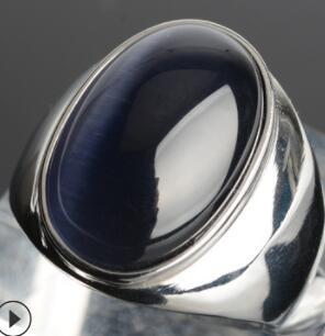 Luxury silver ring with deep blue cat's eye gemstone, minimalist design, premium craftsmanship
