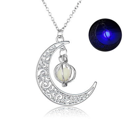 Silver crescent moon necklace with glowing orb pendant, intricate filigree design, luminous glow-in-dark feature