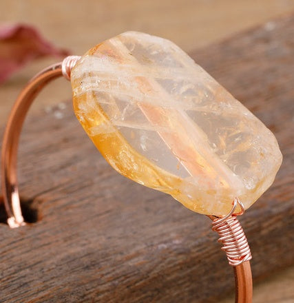 Handcrafted copper bangle with raw citrine stone, minimalist luxury jewelry design