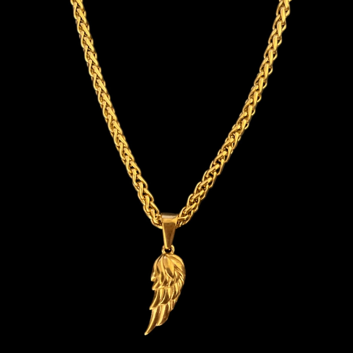 Gold angel wing pendant necklace with braided chain, luxury minimalist jewelry design