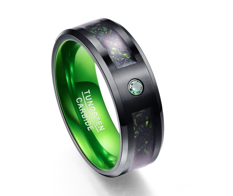 Green tungsten carbide ring with black inlay, glowing pattern, and emerald accent stone — luxury minimalist jewelry