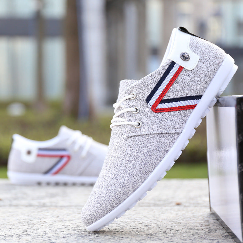 Gray textured men's casual sneaker with red, white, and blue stripe, white laces, and rubber sole