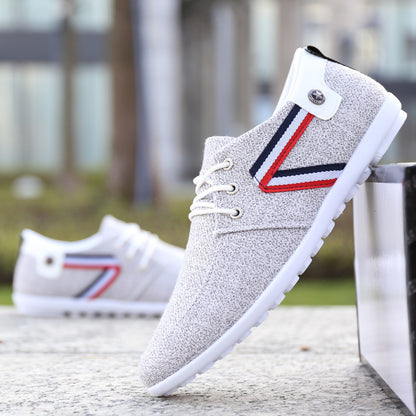 Gray textured men's casual sneaker with red, white, and blue stripe, white laces, and rubber sole
