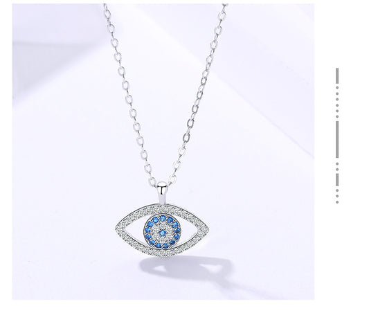 Elegant evil eye pendant necklace with blue and clear crystals, minimalist luxury jewelry design