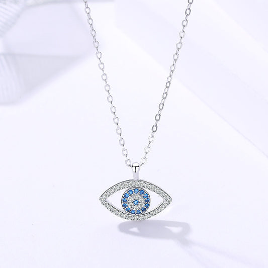 Elegant evil eye pendant necklace with blue and clear crystals, minimalist luxury jewelry design