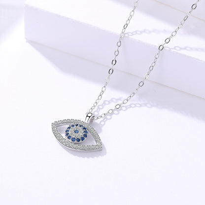 Elegant evil eye pendant necklace with blue and clear crystals, minimalist luxury jewelry design