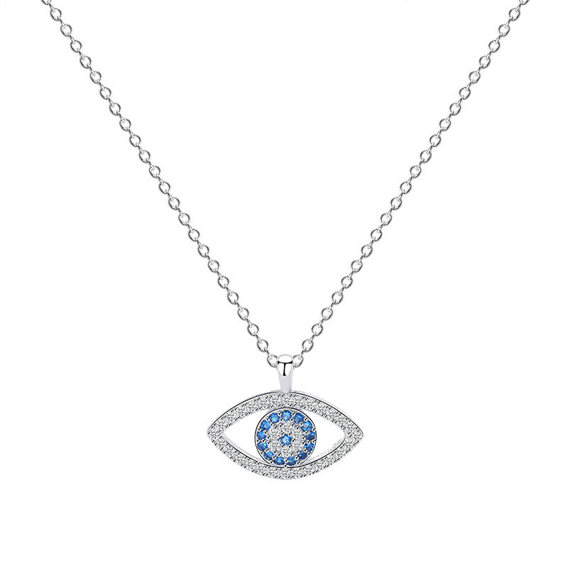 Elegant evil eye pendant necklace with blue and clear crystals on silver chain, minimalist luxury jewelry