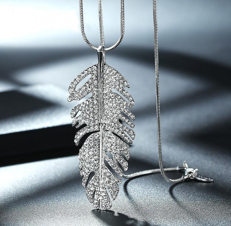 Sparkling leaf pendant necklace with crystal embellishments on snake chain, minimalist luxury jewelry