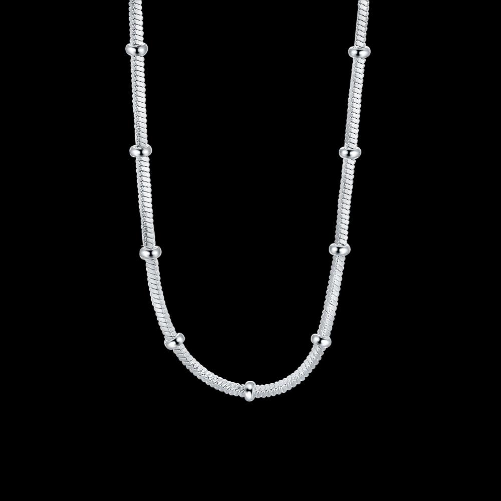 Minimalist silver snake chain necklace with spaced beads, luxury jewelry design