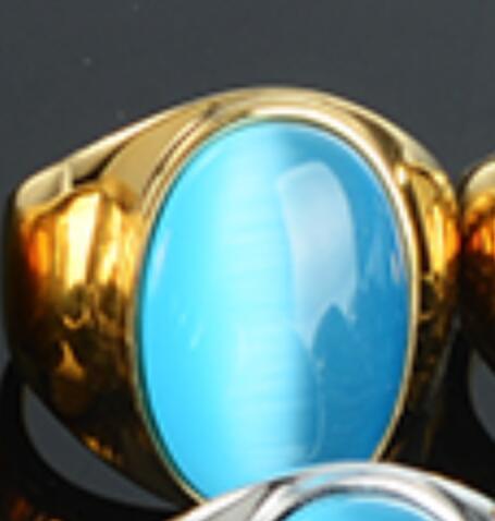 Luxury gold ring with oval blue gemstone, minimalist design, premium jewelry