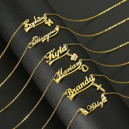 Personalized gold name necklaces with charms on black leather background