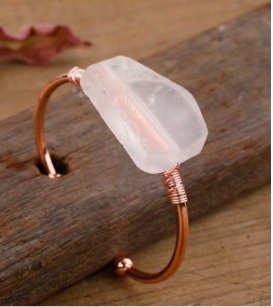 Rose quartz crystal cuff bracelet with copper wire wrapping, minimalist luxury jewelry design