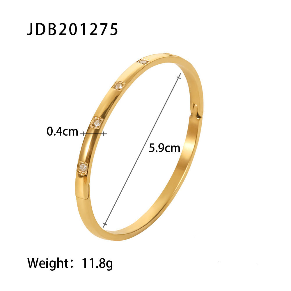 Gold bangle with embedded crystals, 0.4cm width, 5.9cm diameter, 11.8g weight — minimalist luxury jewelry