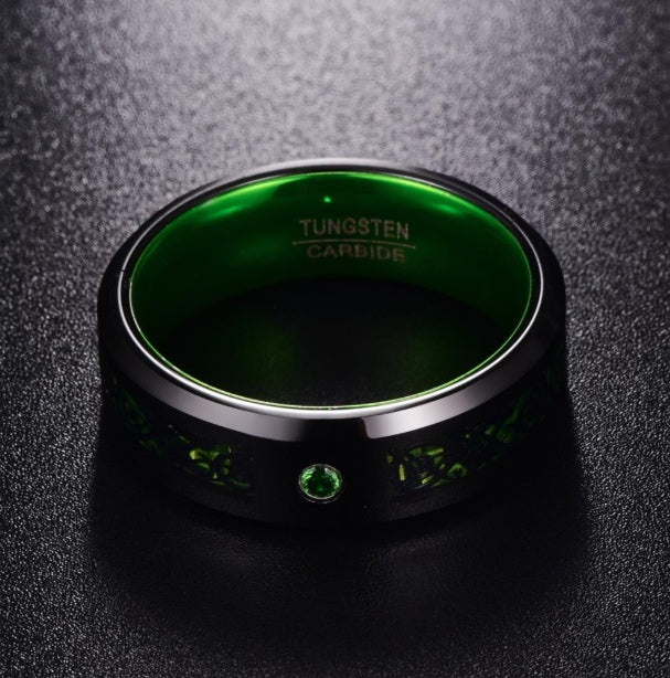 Tungsten carbide ring with green glow interior and emerald accent, minimalist luxury design