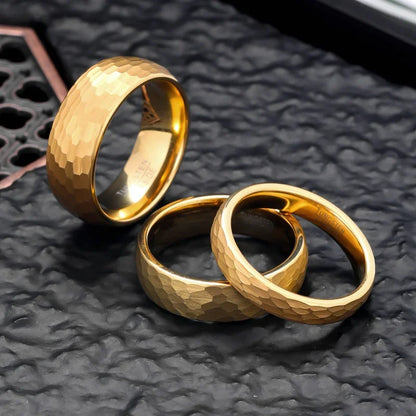 Luxury gold rings with hammered texture, minimalist design, premium craftsmanship on dark textured surface