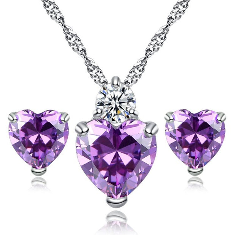 Purple heart-shaped crystal pendant necklace and matching stud earrings, silver-tone setting