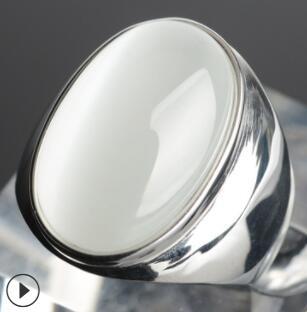 Elegant silver ring with smooth white stone, minimalist luxury jewelry design