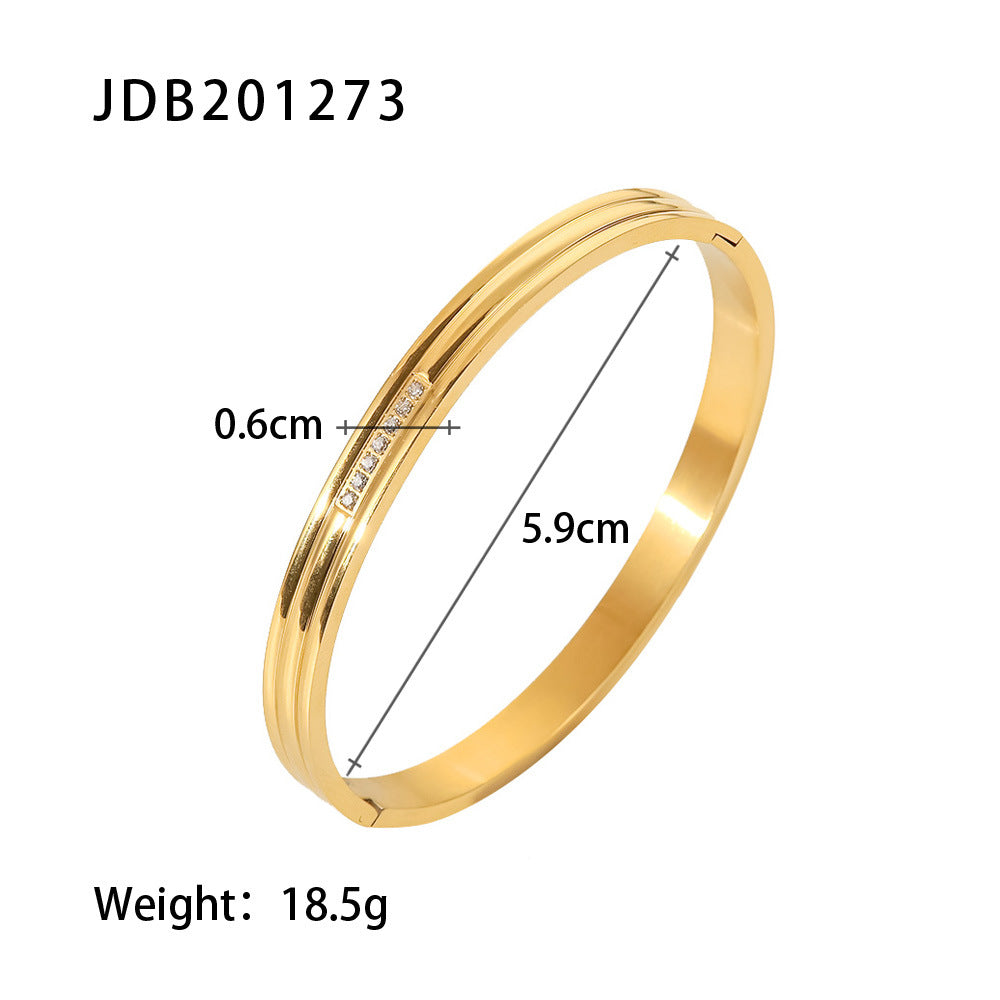 Gold bangle with diamond accents, 0.6cm width, 5.9cm diameter, 18.5g weight — minimalist luxury jewelry