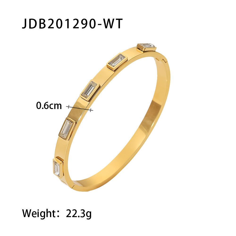 Gold bangle with baguette-cut stones, 0.6cm width, minimalist luxury jewelry design