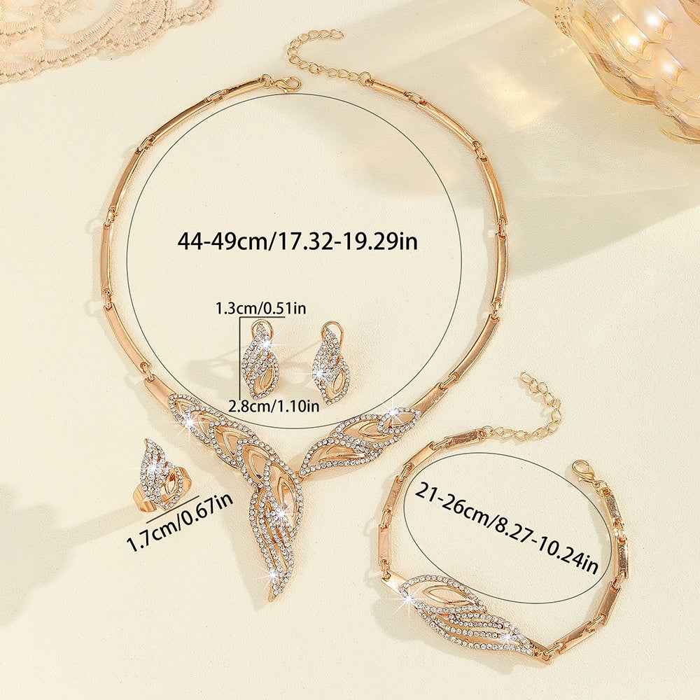 Elegant rose gold jewelry set with crystal-embellished leaf design, including necklace, earrings, ring, and bracelet