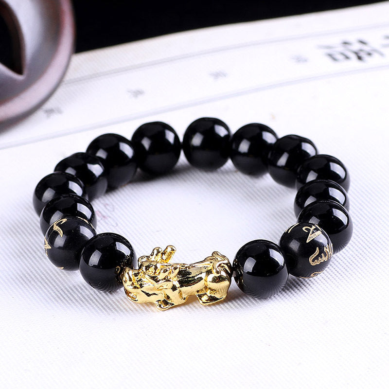 Luxury black bead bracelet with gold dragon charm, minimalist design, premium handcrafted jewelry