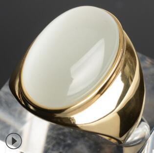 Luxury gold ring with smooth white stone, minimalist design, premium quality jewelry