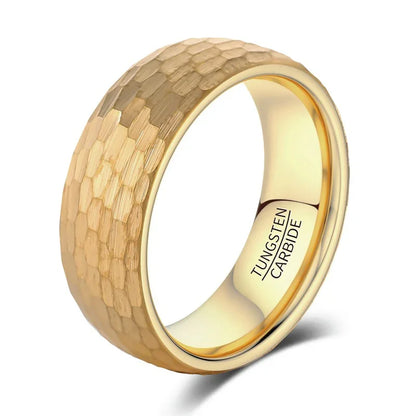 Gold tungsten carbide wedding band with hammered texture and polished interior, minimalist luxury design