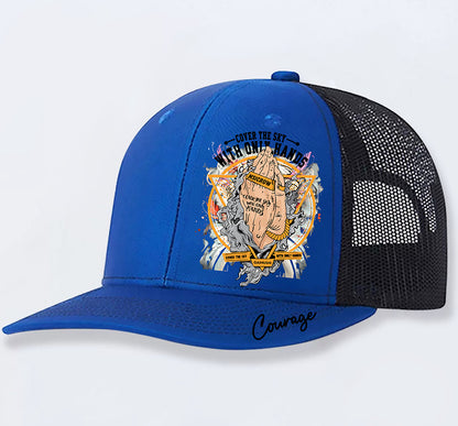 Blue trucker hat with bold graphic design, 'Cover the Sky with Only Hands' text, and 'Courage' script on brim
