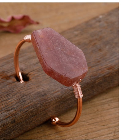 Handcrafted copper cuff bracelet with raw pink stone, minimalist luxury jewelry design