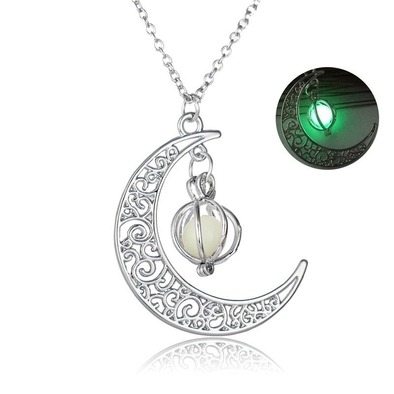 Silver crescent moon necklace with glowing orb pendant, intricate filigree design, luminous night glow feature