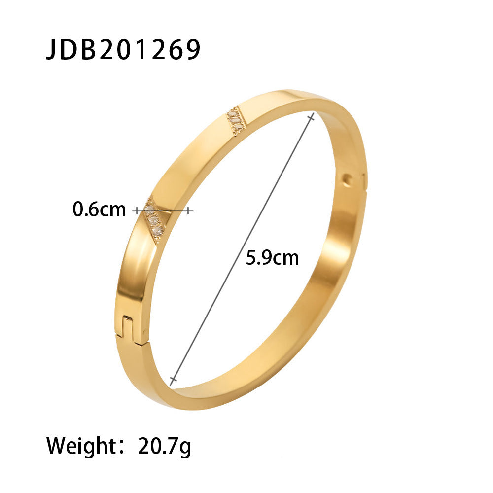 Gold bangle with diamond accents, 0.6cm width, 5.9cm diameter, 20.7g weight — minimalist luxury jewelry