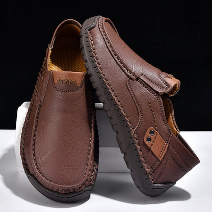 Brown leather loafers with hand-stitched detailing and textured sole, minimalist men's footwear design