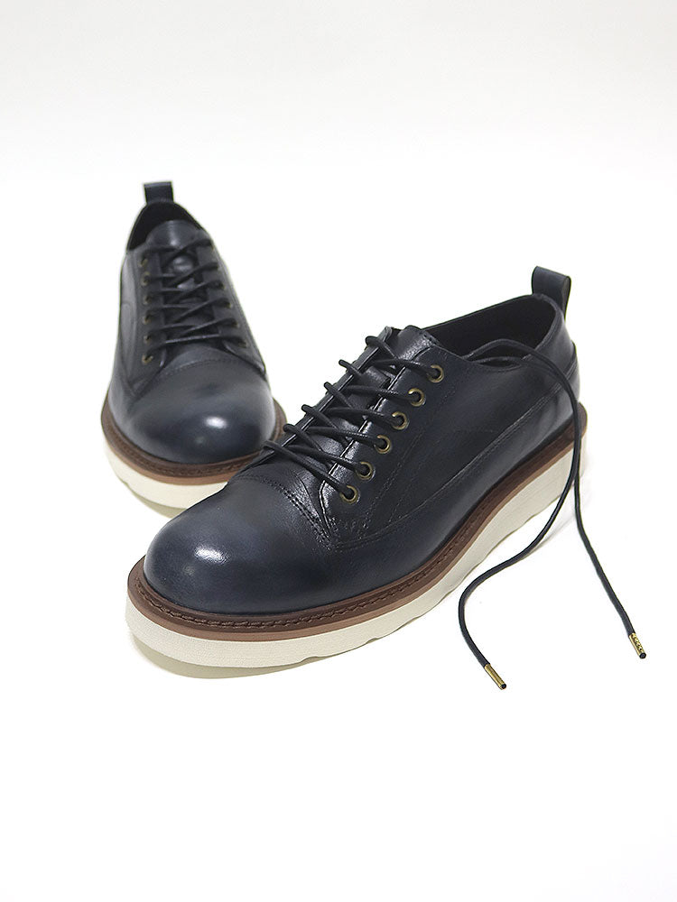 Dark navy leather lace-up shoes with cream sole, minimalist design, premium handcrafted footwear