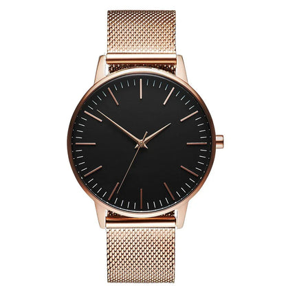 Rose gold minimalist watch with black dial and mesh strap, luxury timepiece design