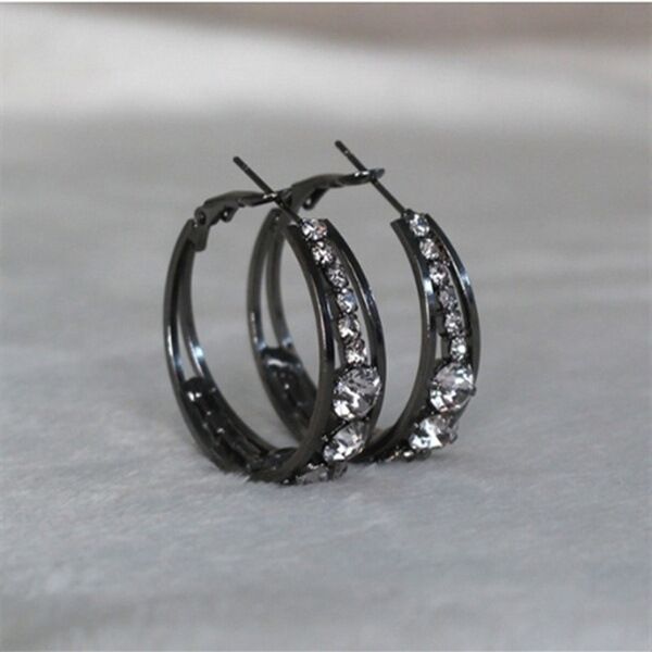 Black hoop earrings with sparkling crystal accents, minimalist luxury jewelry design