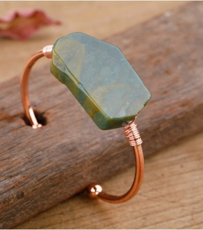 Handcrafted copper cuff bracelet with green stone, minimalist luxury jewelry design