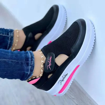 Black mesh slip-on sneaker with white platform sole and pink accent, styled with denim and gold anklet