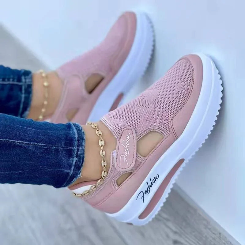 Pink mesh slip-on sneakers with white platform sole, gold chain anklet, and 'Fashion' script detail