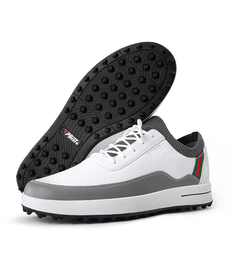White and gray golf shoe with red-green stripe, spiked sole, and minimalist design