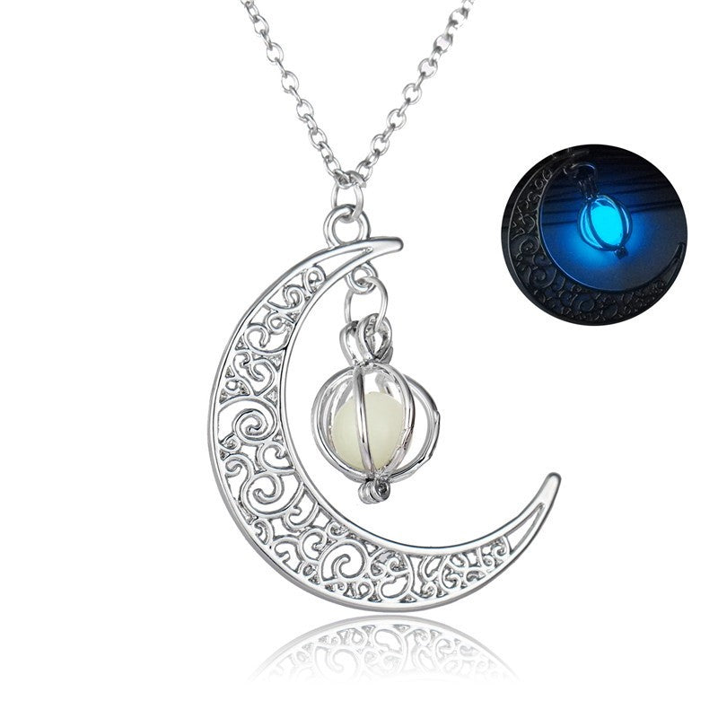 Silver crescent moon necklace with glowing orb pendant, intricate filigree design, luminous night glow feature