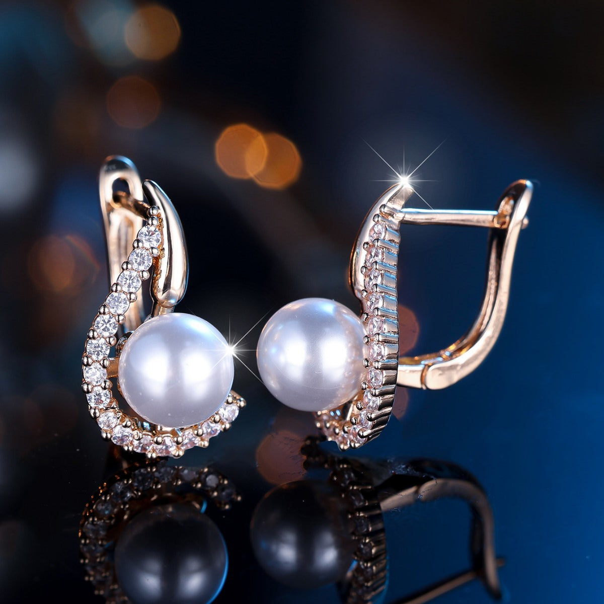 Elegant pearl earrings with crystal accents, minimalist luxury design on reflective surface