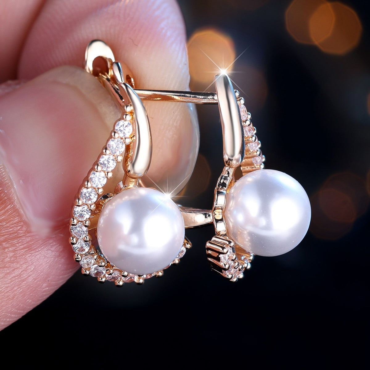 Luxury pearl earrings with rose gold and crystal accents, minimalist design