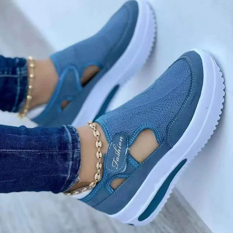 Blue slip-on platform sneakers with cutout details, gold chain anklet, and white sole — stylish casual footwear