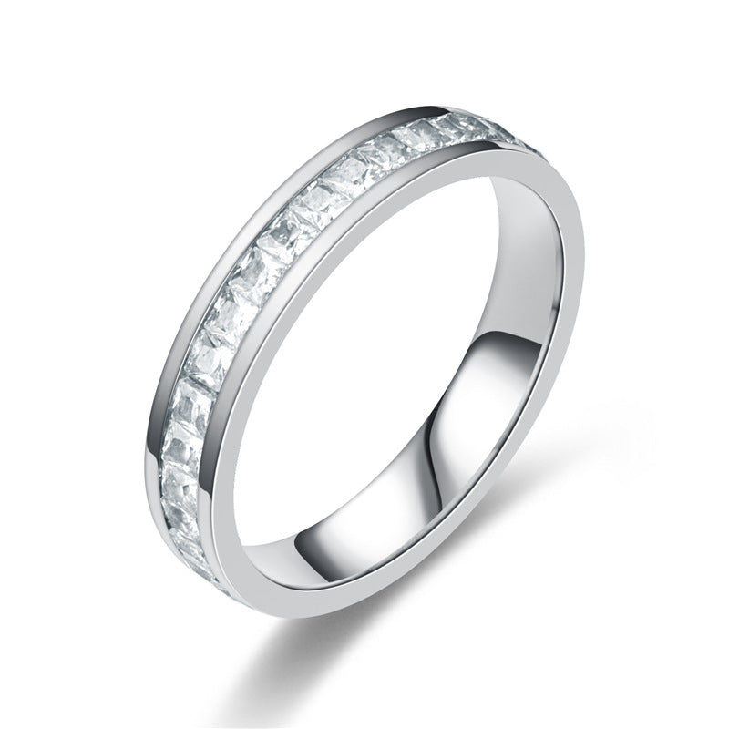 Elegant silver ring with channel-set square-cut diamonds, minimalist luxury jewelry design