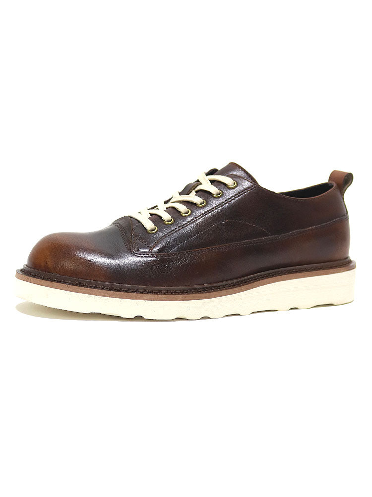 Brown leather lace-up shoe with white sole, minimalist design, premium handcrafted footwear